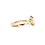 Radiant solitaire with elevated shoulders gold