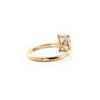 Radiant solitaire with elevated shoulders gold